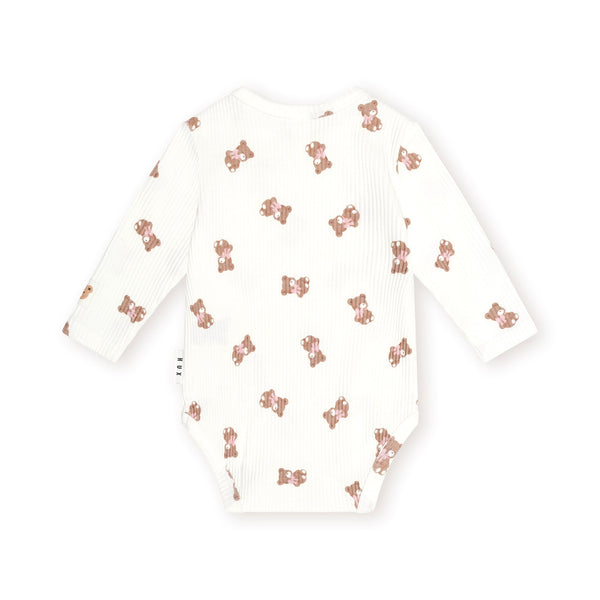 White Tumbling Bow Huxette Long Sleeves Onesie